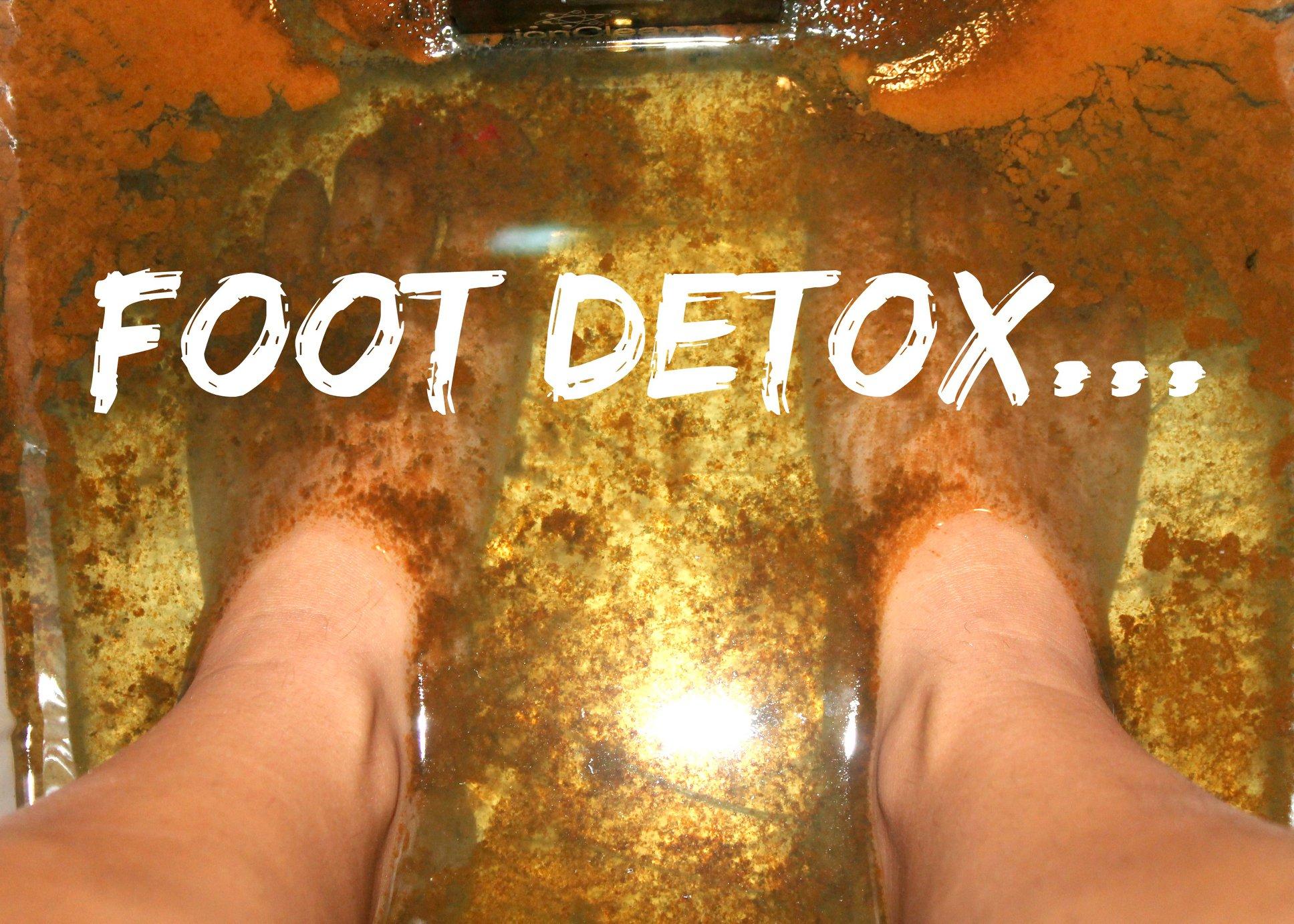 Client soaking feet in detox bath
