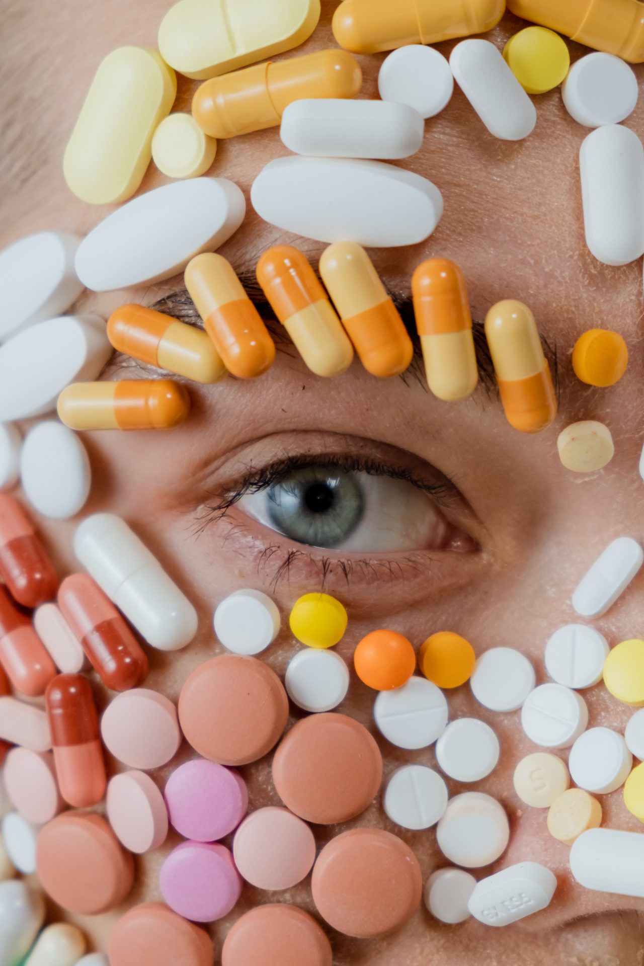 closeup photo of assorted medicines surrounding a persons eye