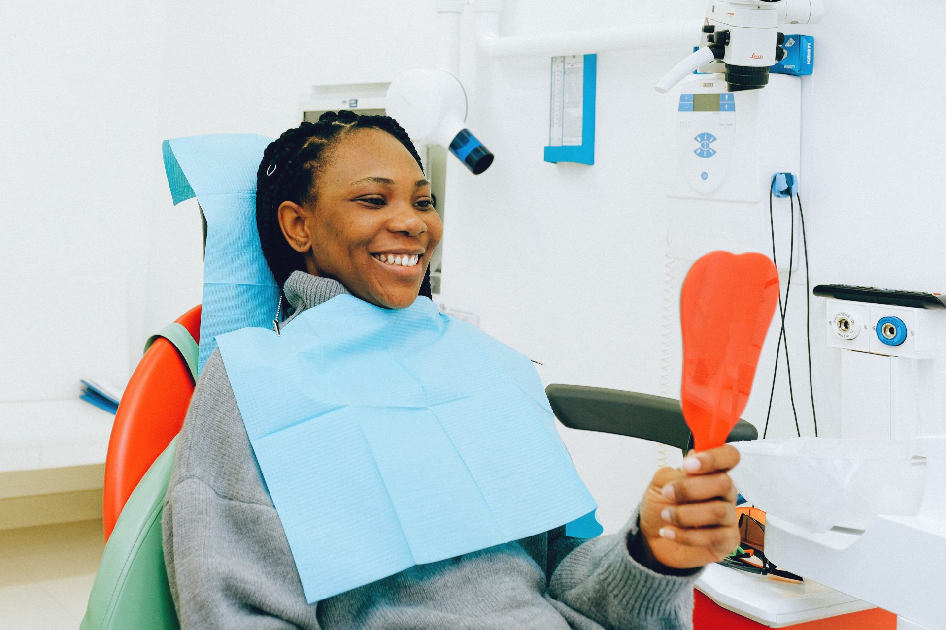 Woman in Dental Clinic checking her teeth