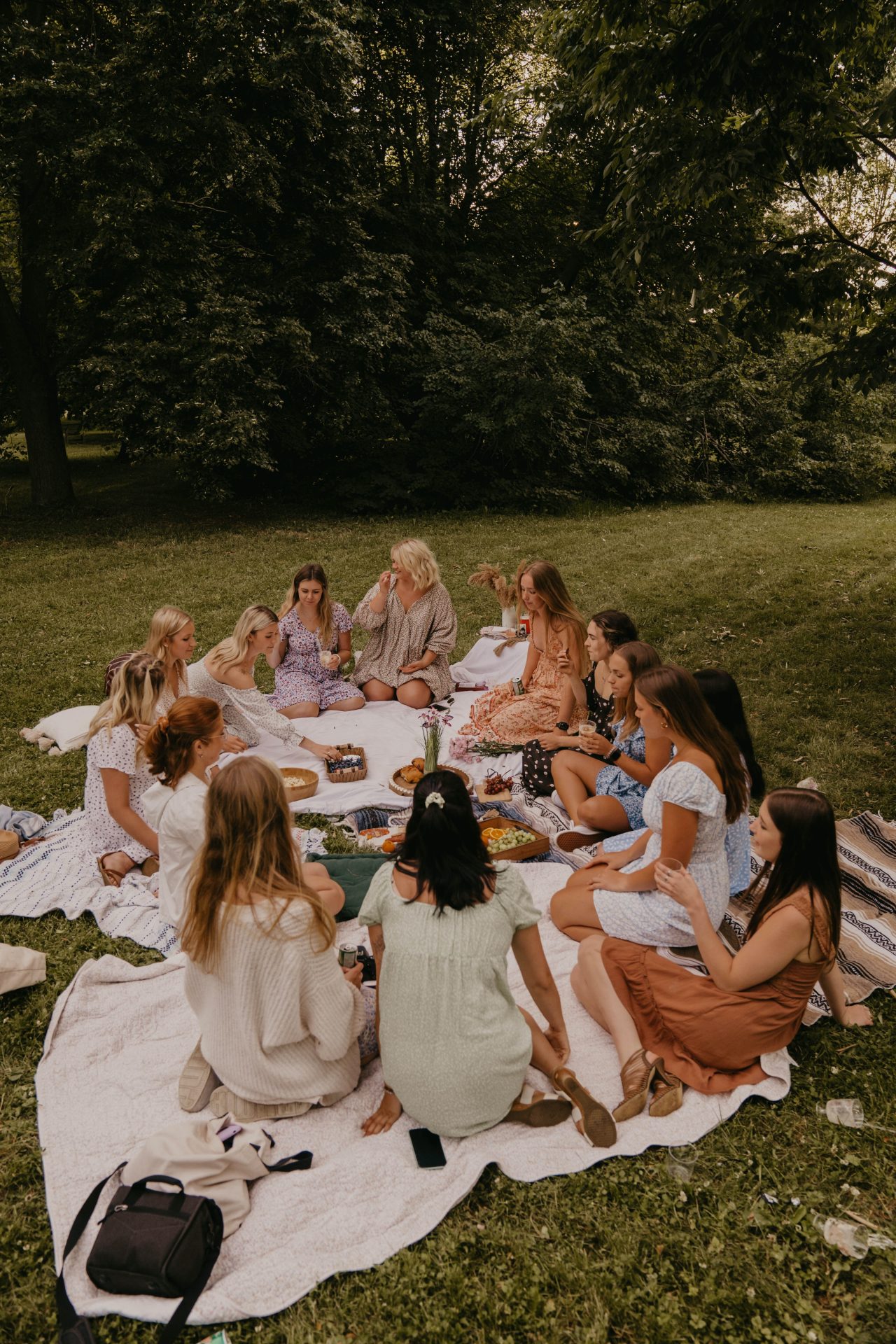 group of women having picnic at the park