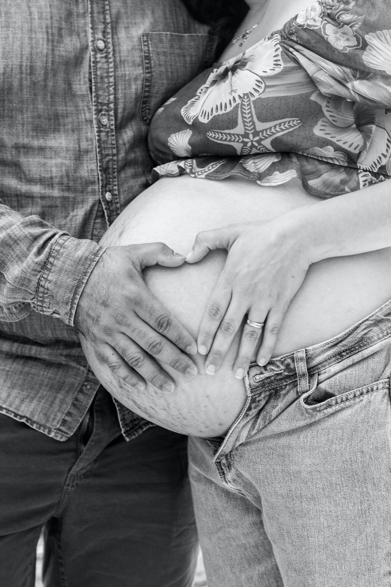 touching a pregnant women's tummy